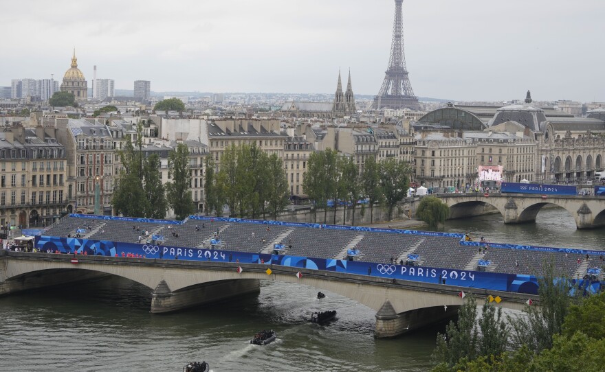 Historic river parade, Dion showstopper ignite Paris Olympics